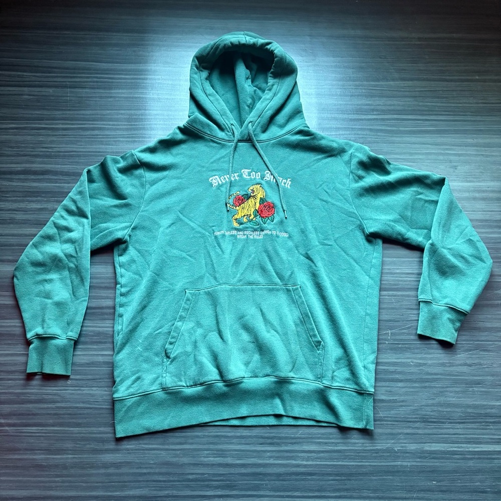 Green cotton hoodie with a unique design